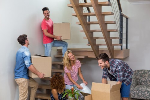 House movers in Bermondsey handling bulky furniture with care