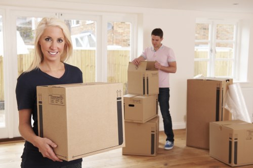 Removal team preparing boxes and furniture for a Bermondsey move