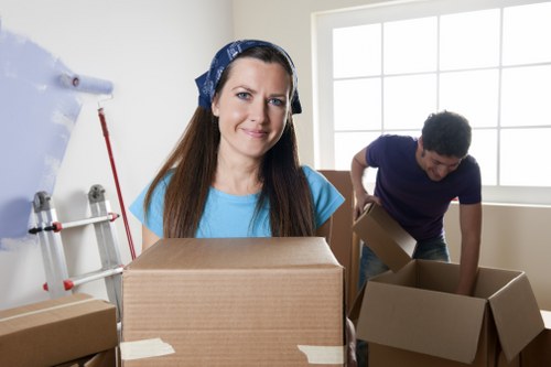 Professional movers loading furniture for an office move in Bermondsey