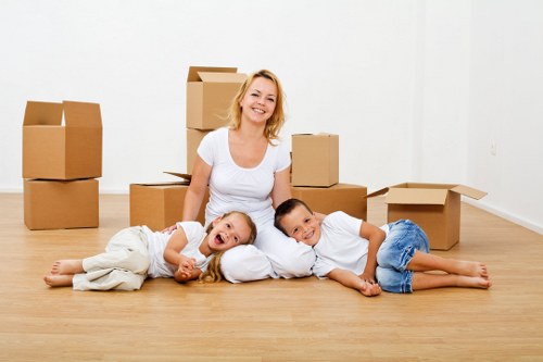 Professional movers packing boxes for a Bermondsey house relocation