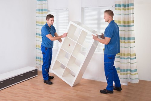 Trained movers handling furniture with care
