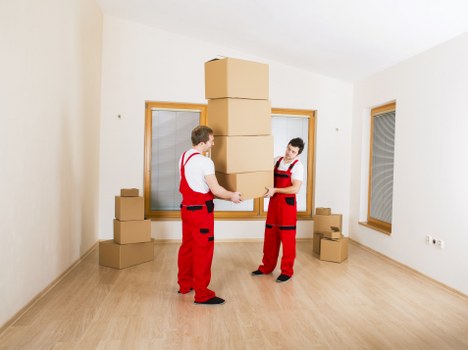 Final stage of an office relocation with boxes and furniture arranged in the new space